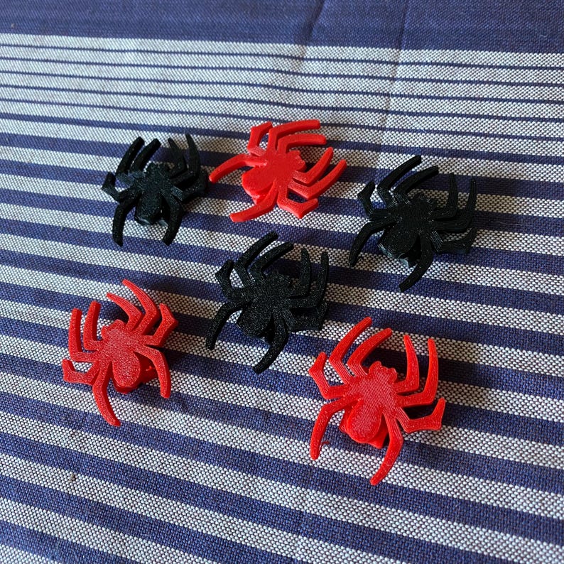 spider themed bike decorations for a bicycle wheel - red and black