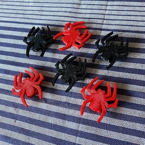 spider themed bike decorations for a bicycle wheel - red and black