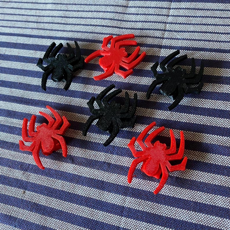 spider themed bike decorations for a bicycle wheel - red and black