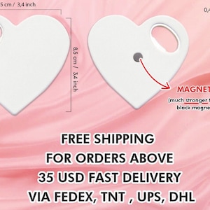 May include: White heart-shaped bottle opener with a magnet on the back. The bottle opener is 3.4 inches wide and 3.4 inches tall. The magnet is 0.16 inches thick.