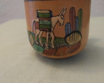 Decorated terra cotta cup