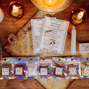 May include: A fertility spell kit with instructions and six small bags of herbs and crystals. The bags are labeled with the names of the herbs and crystals: Red Clover, Sandalwood, Sea Salt, Unakite, Patchouli, Sage, and Jasmine.