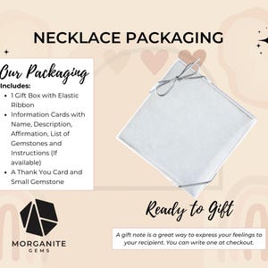 May include: Image of necklace packaging with a white gift box tied with a silver ribbon. The packaging includes a gift box, information cards, and a thank you card. The text reads "Necklace Packaging" and "Ready to Gift."
