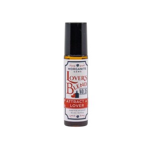 May include: A brown glass roll-on bottle with a black cap. The label reads "Morganite Gems Lovers Blend No.15 Attract a Lover Essential oil blend 10 ml / .34 fl oz".