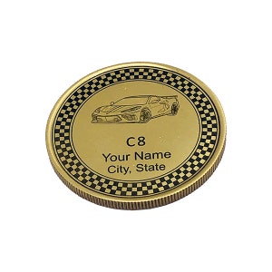 May include: Gold-colored coin with a black and white checkered border. The center of the coin features a line drawing of a sports car and the text "C8 Your Name City, State".