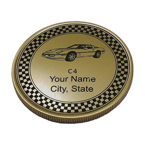 May include: Gold-colored coin with a black and white checkered border. The center of the coin features a black and white silhouette of a Corvette C4 with the text "C4 Your Name City, State".