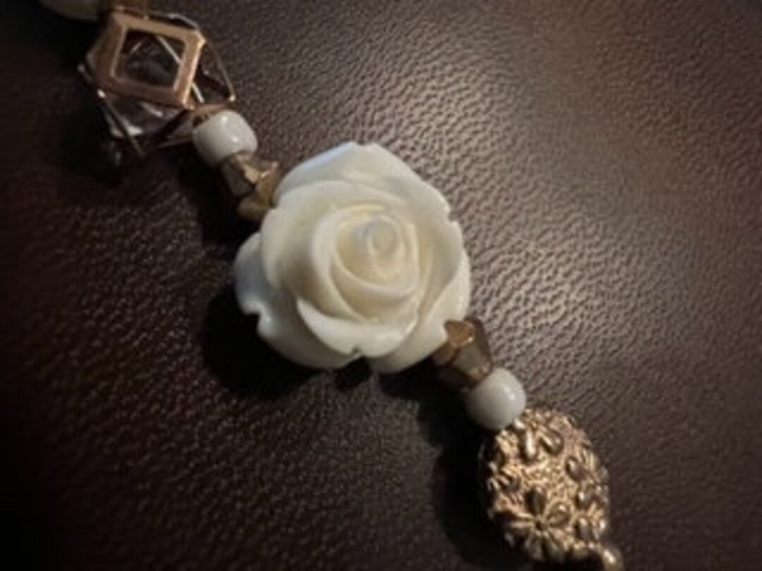 Beautiful Gold Bracelet with White Flower. main image 1