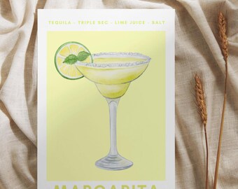 May include: A watercolor illustration of a margarita cocktail with a lime wedge and a sprig of mint. The text "TEQUILA - TRIPLE SEC - LIME JUICE - SALT" is above the cocktail and the text "MARGARITA" is below the cocktail.