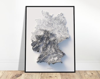 May include: A black and white 3D topographic map of Germany, framed in a black frame. The map is printed on white paper and has a white background.