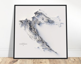 May include: A white and gray 3D topographic map of Croatia. The map is framed in a black frame and is set against a white wall.