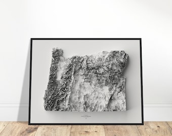 Puede incluir: Un mapa topográfico en blanco y negro del estado de Oregón. El mapa está enmarcado en un marco negro y está colgado en una pared blanca.