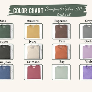 May include: Color chart of Comfort Color 1717 t-shirts in various colors. The chart displays folded t-shirts in shades like moss, mustard, espresso, grey, pepper, ivory, yam, orchid, blue jean, crimson, bay, and violet.