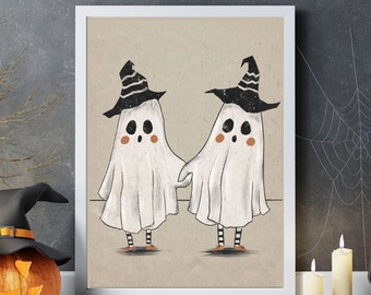 May include: Two white ghosts wearing black and white witch hats with orange accents. The ghosts are holding hands and smiling. The image is set against a beige background.