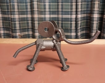 Handcrafted welded upcycled Metal Lucky Elephant. Nuts and bolts, scrap metal, pipe, washers, threaded rod.