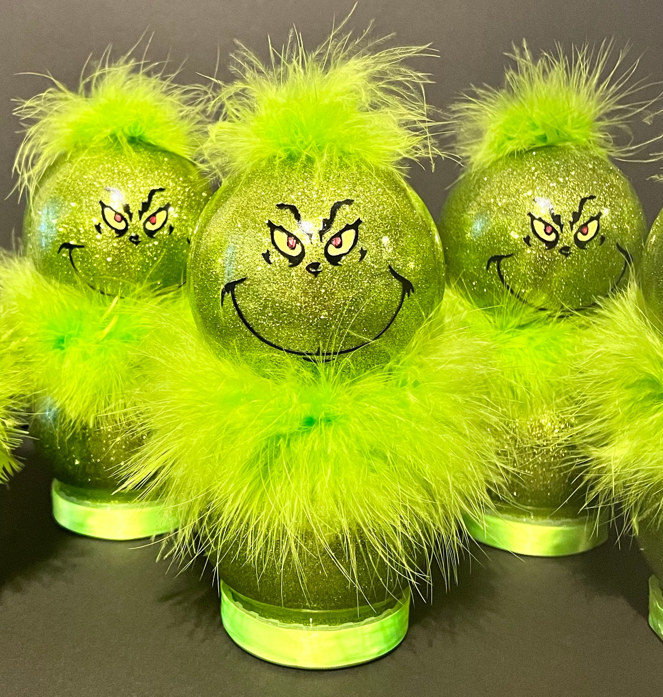 Drawing inspiration from the Grinch, this delightful light-up decor stands between 8 to 10 inches tall, with a mini version available
