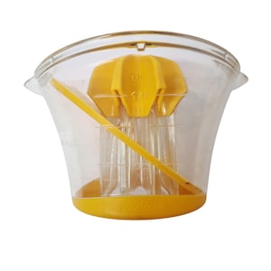 May include: A clear plastic citrus juicer with a yellow reamer and measuring cup. The juicer has a yellow handle and a yellow reamer with the text "cup" and "1/2". The base of the juicer has the text "goodcook".