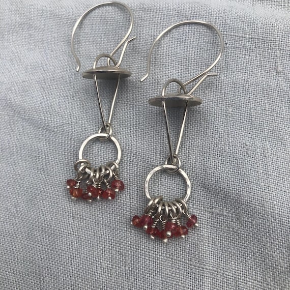 Red-orange sapphire kinetic chandelier earrings in argentium sterling silver