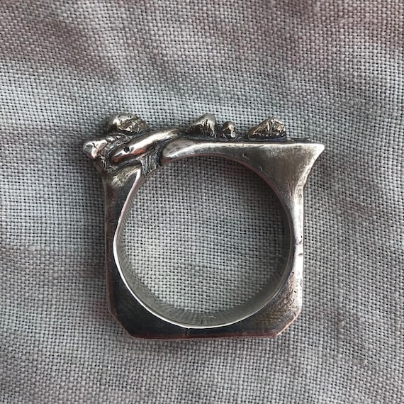 Snake on a rock wall ring in argentium sterling silver // U.S. size 11