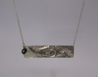 Green tourmaline bar necklace in chased and repoussé argentium sterling silver