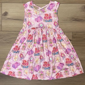 Whimsical “It’s a Small World” Pink Dress