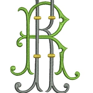 May include: An embroidered monogram featuring the intertwined letters R and L. The letter R is rendered in a dark grey thread with gold accents, while the letter L is stitched in a vibrant green thread with decorative flourishes and curves.
