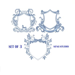 May include: Three blue embroidered shield designs with ornate floral and scrollwork borders. One shield features a rocking horse. The text "SET OF 3" and "SENUSTUDIO" are also visible.