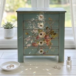 May include: A set of three ceramic mugs with a speckled, matte finish. The mugs are in shades of cream, light gray, and dark gray. Each mug has a simple, minimalist design, perfect for coffee or tea.