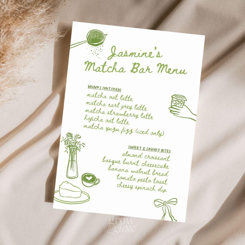 May include: A white menu card with green illustrations and text for Jasmine's Matcha Bar. The menu lists matcha drinks and sweet and savory bites, including matcha oat latte, almond croissant, and basque burnt cheesecake.