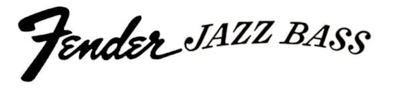 May include: The words "Fender JAZZ BASS" are displayed in black script on a white background. "Fender" is in a stylized cursive font, while "JAZZ BASS" is in a more standard font.