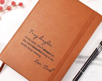 May include: A brown leather journal with the inscription "To my daughter, In my eyes, you'll always be the most beautiful thing in the world. Keep shining. Love, Dad."
