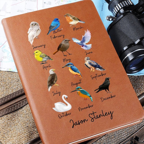 A leather journal themed around your birth month bird — niche, nature-forward, and personal in a way that goes beyond a simple monogram.