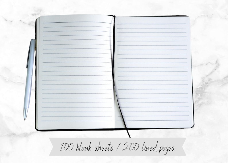 May include: A black lined notebook with a black ribbon bookmark. The notebook is open to reveal lined pages. The text "100 blank sheets / 200 lined pages" is visible below the notebook.