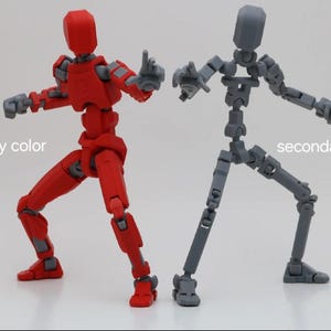Op de afbeelding: Twee gearticuleerde actie figuren, een rood en een grijs, in een vechtpose. De rode figuur is gelabeld "primaire kleur" en de grijze figuur is gelabeld "secundaire kleur".