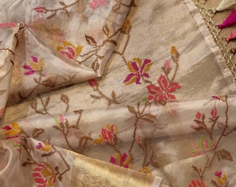 Pure tissue organza silk embroidery crossstitched saree.