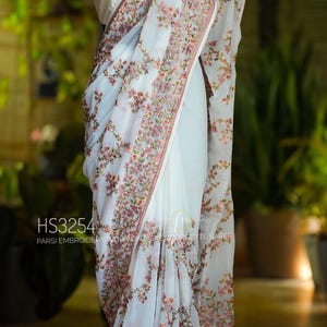 Beautiful machine embroidery Parsi work on pure georgette saree.