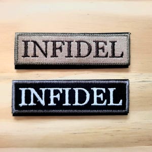 May include: Two rectangular embroidered patches with the word "INFIDEL". One patch is tan with brown lettering, the other is black with white lettering. The patches are on a light wood surface.