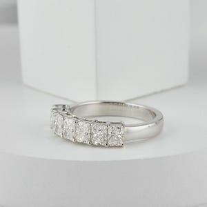 stunning Radiant Cut Lab Grown Diamond Half Eternity Band, designed for timeless beauty and ethical elegance. Featuring brilliant lab diamonds in a sleek half eternity setting, this ring shines with eco friendly craftsmanship and conflict-free luxury. Perfect as a diamond engagement ring, ethical wedding band, or meaningful anniversary gift for her.