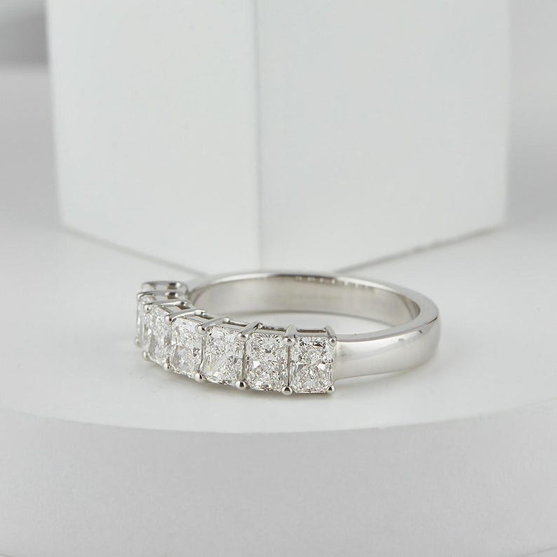 stunning Radiant Cut Lab Grown Diamond Half Eternity Band, designed for timeless beauty and ethical elegance. Featuring brilliant lab diamonds in a sleek half eternity setting, this ring shines with eco friendly craftsmanship and conflict-free luxury. Perfect as a diamond engagement ring, ethical wedding band, or meaningful anniversary gift for her.