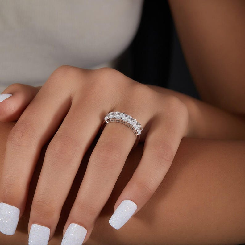 stunning Radiant Cut Lab Grown Diamond Half Eternity Band, designed for timeless beauty and ethical elegance. Featuring brilliant lab diamonds in a sleek half eternity setting, this ring shines with eco friendly craftsmanship and conflict-free luxury. Perfect as a diamond engagement ring, ethical wedding band, or meaningful anniversary gift for her.