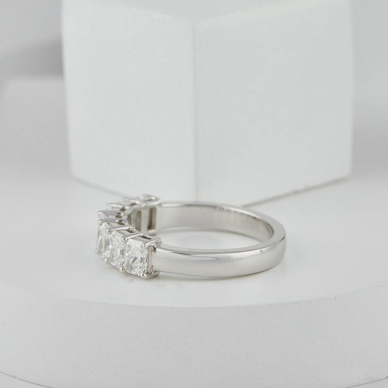 stunning Radiant Cut Lab Grown Diamond Half Eternity Band, designed for timeless beauty and ethical elegance. Featuring brilliant lab diamonds in a sleek half eternity setting, this ring shines with eco friendly craftsmanship and conflict-free luxury. Perfect as a diamond engagement ring, ethical wedding band, or meaningful anniversary gift for her.