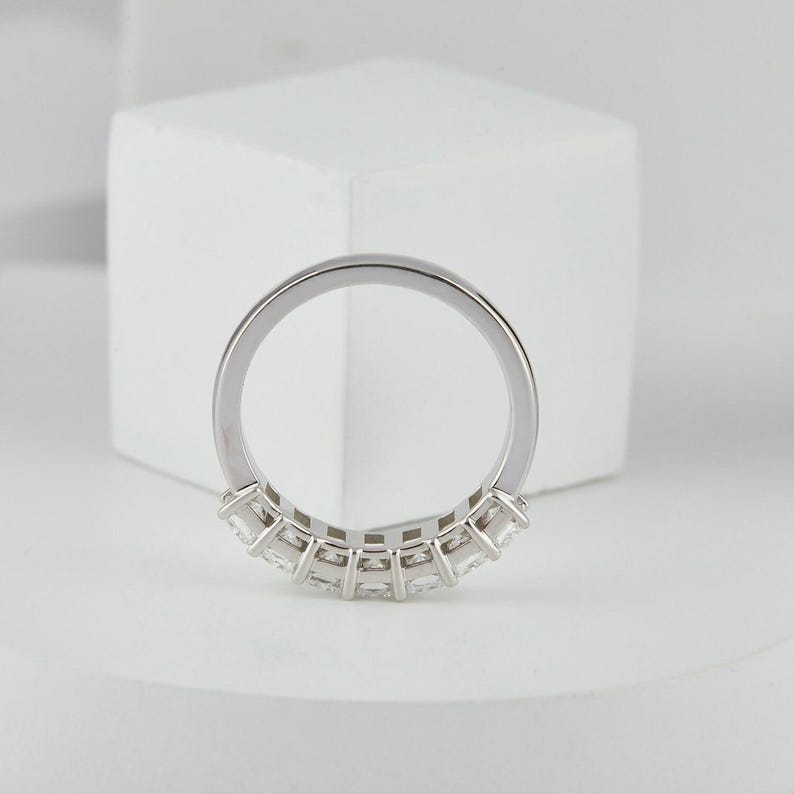 stunning Radiant Cut Lab Grown Diamond Half Eternity Band, designed for timeless beauty and ethical elegance. Featuring brilliant lab diamonds in a sleek half eternity setting, this ring shines with eco friendly craftsmanship and conflict-free luxury. Perfect as a diamond engagement ring, ethical wedding band, or meaningful anniversary gift for her.