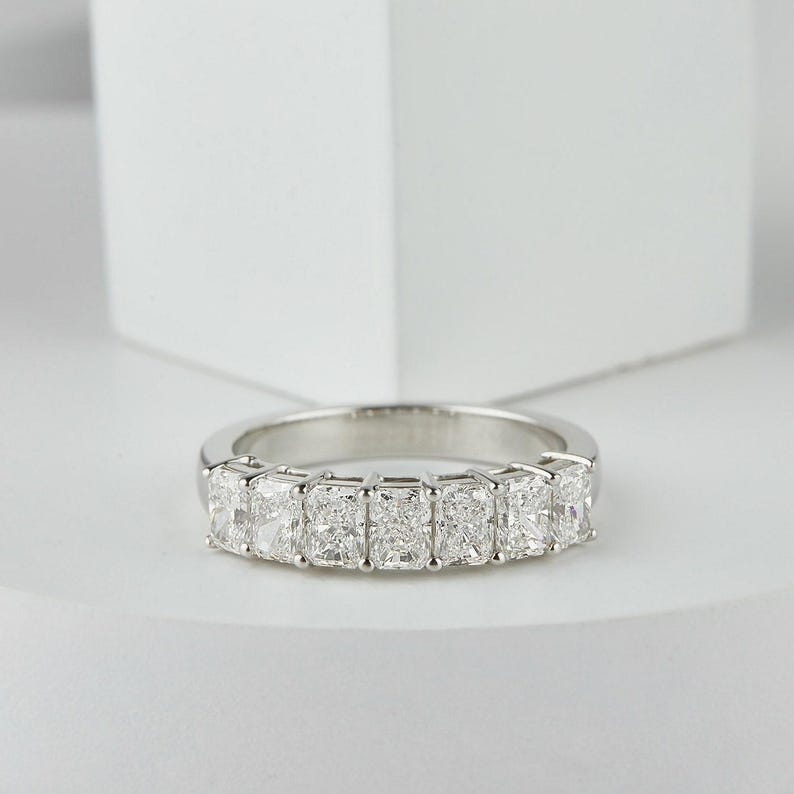 stunning Radiant Cut Lab Grown Diamond Half Eternity Band, designed for timeless beauty and ethical elegance. Featuring brilliant lab diamonds in a sleek half eternity setting, this ring shines with eco friendly craftsmanship and conflict-free luxury. Perfect as a diamond engagement ring, ethical wedding band, or meaningful anniversary gift for her.