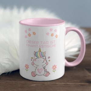 Taza de afirmación motivadora para niños con un lindo motivo de unicornio: ¡Este día es fantástico! - Taza bicolor