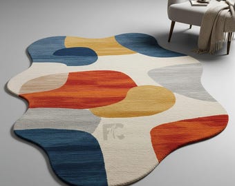 Puede incluir: Alfombra abstracta con forma irregular. Presenta un patrón de formas superpuestas en azul, naranja, amarillo, gris y crema. Esta alfombra está diseñada para añadir un toque moderno a cualquier espacio habitable, con una variedad de colores.