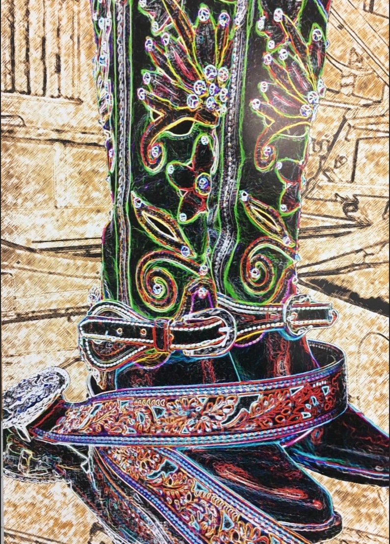May include: A pair of black cowboy boots with intricate green, red, and blue embroidery and rhinestones. The boots have a black leather belt with a silver buckle and a brown leather belt with a silver buckle.