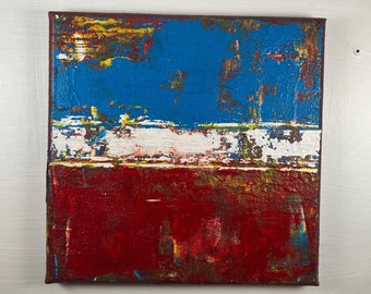 May include: Abstract painting on canvas with a blue, white and red colour scheme. The painting has a textured surface and a modern style.