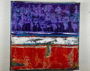 Puede incluir: Pintura abstracta sobre lienzo con un esquema de color morado, blanco y rojo. La pintura está dividida en tres secciones, la sección superior es morada, la sección del medio es blanca y la sección inferior es roja.
