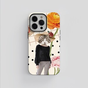 May include: A white iPhone case with a black and white polka dot pattern. The case features a cat wearing a straw hat and a black sweater. The cat is surrounded by flowers in shades of pink, orange, and red.