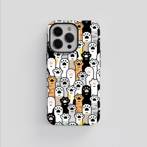 May include: A white iPhone case with a pattern of colorful cat paws. The case has a black camera bump with three lenses.