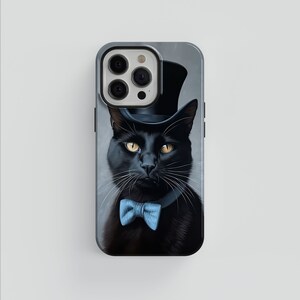 May include: A black cat wearing a top hat and a blue bow tie. The cat is looking directly at the camera with a serious expression.